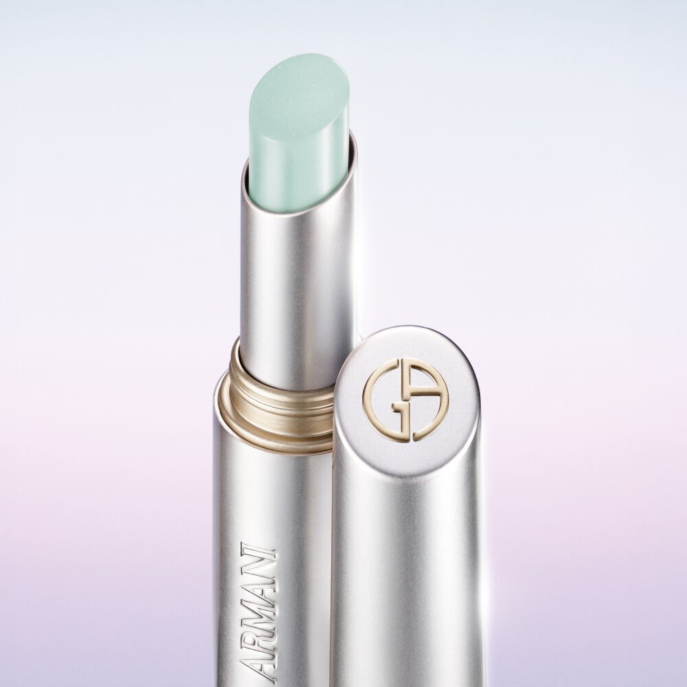 Armani Prisma Flash lipstick in a ph reactive  shade, showcased with its elegant silver packaging and signature GA logo.