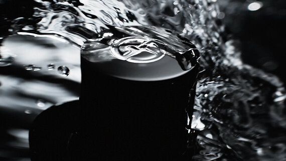 Giorgio Armani Acqua Di Gio Eau de Parfum Intense bottle shown with key ingredients in a marine setting.