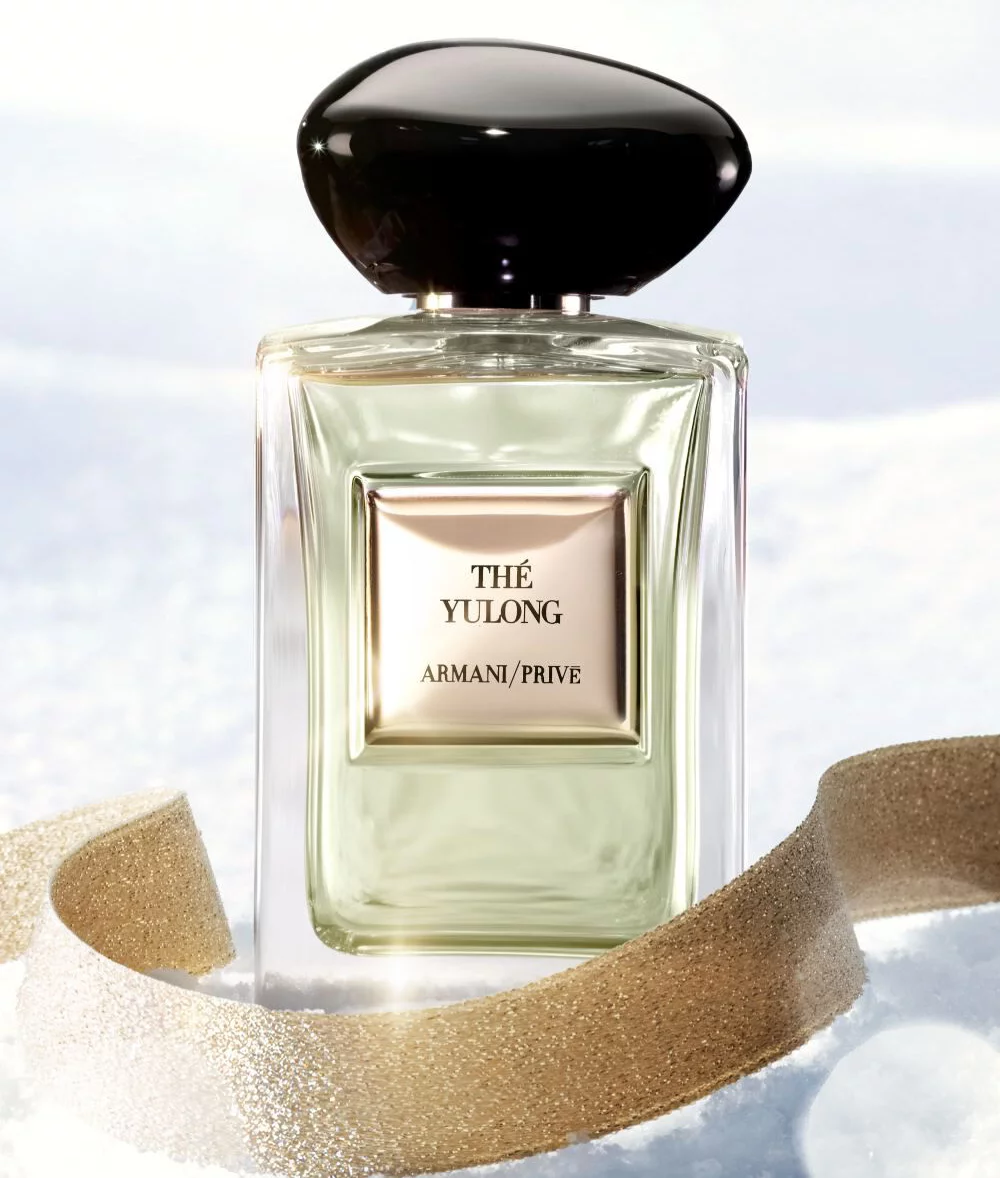 Armani/Prive The Yulong fragrance on snow with a gold ribbon for the holiday season.