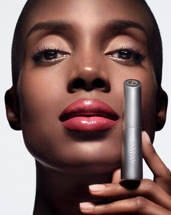 Armani Prisma Flash lipstick showcased in hand, emphasizing the sleek, modern packaging and rich, luminous formula.