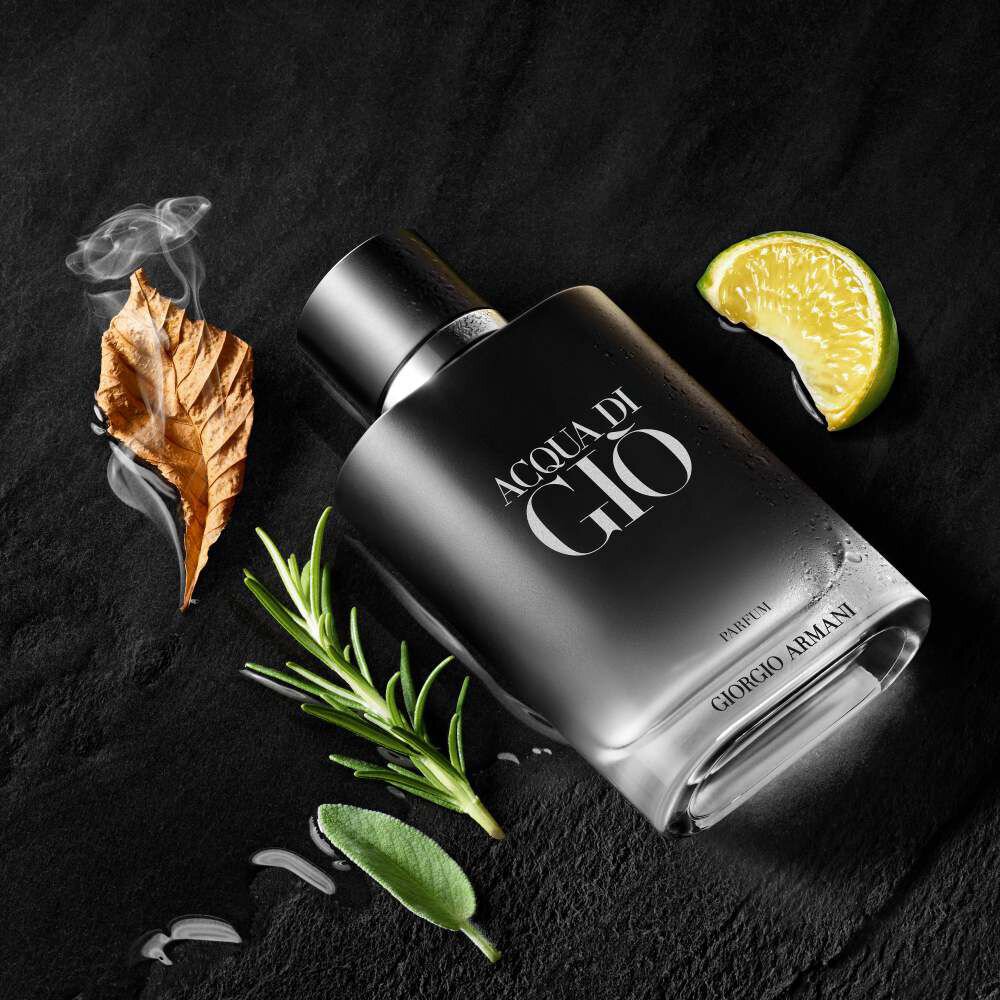 Giorgio Armani Acqua Di Gio Parfum bottle on a black background with bergamot, ginger, rosemary, and clary sage.