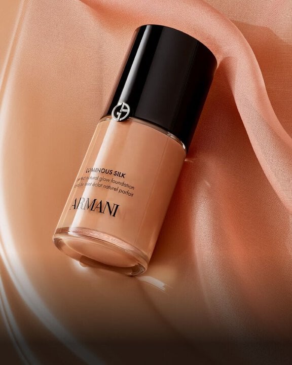 A close-up swirl of LUMINOUS SILK FOUNDATION shade, showcasing its weightless, silky texture and natural glow, indicative of its truer-to-skin formula.