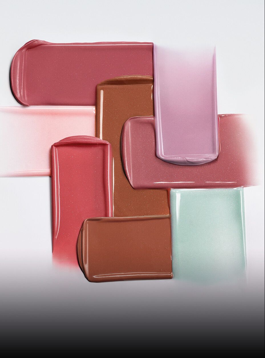 Armani Prisma Flash lipstick swatch in mauve, displayed with the iconic GA logo embossed in creamy, glossy color.