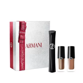 Armani beauty Holiday 2026 open white gift box with red ribbon containing Vertigo mascara and Eye Tint shades 68S Bronzy Brown and 22M Cashew, white background.
