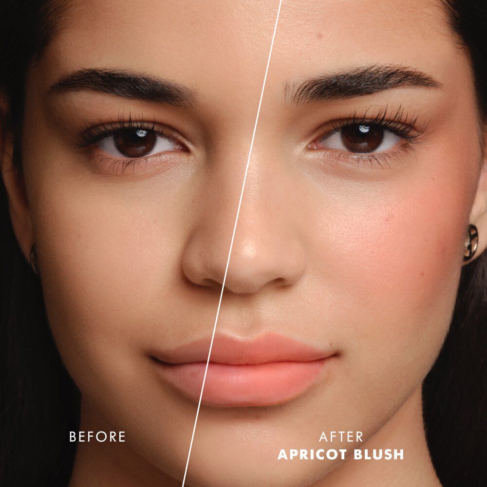Model applying ARMANI Beauty Dolci Blush pink cheek tint to the lips