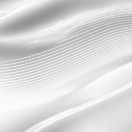 Close-up of textured white CREMA NERA Sheer Cream.