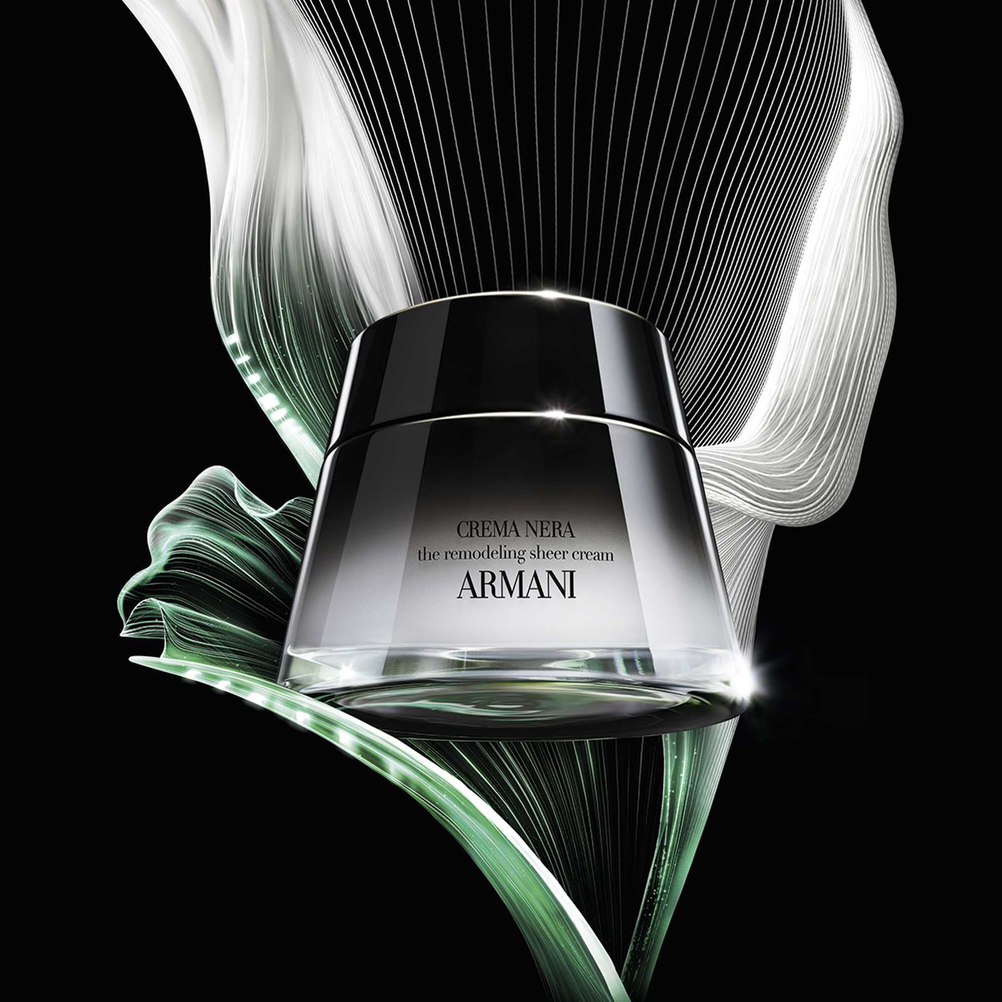 Giorgio Armani CREMA NERA Sheer Cream jar with flowing green and white elements.